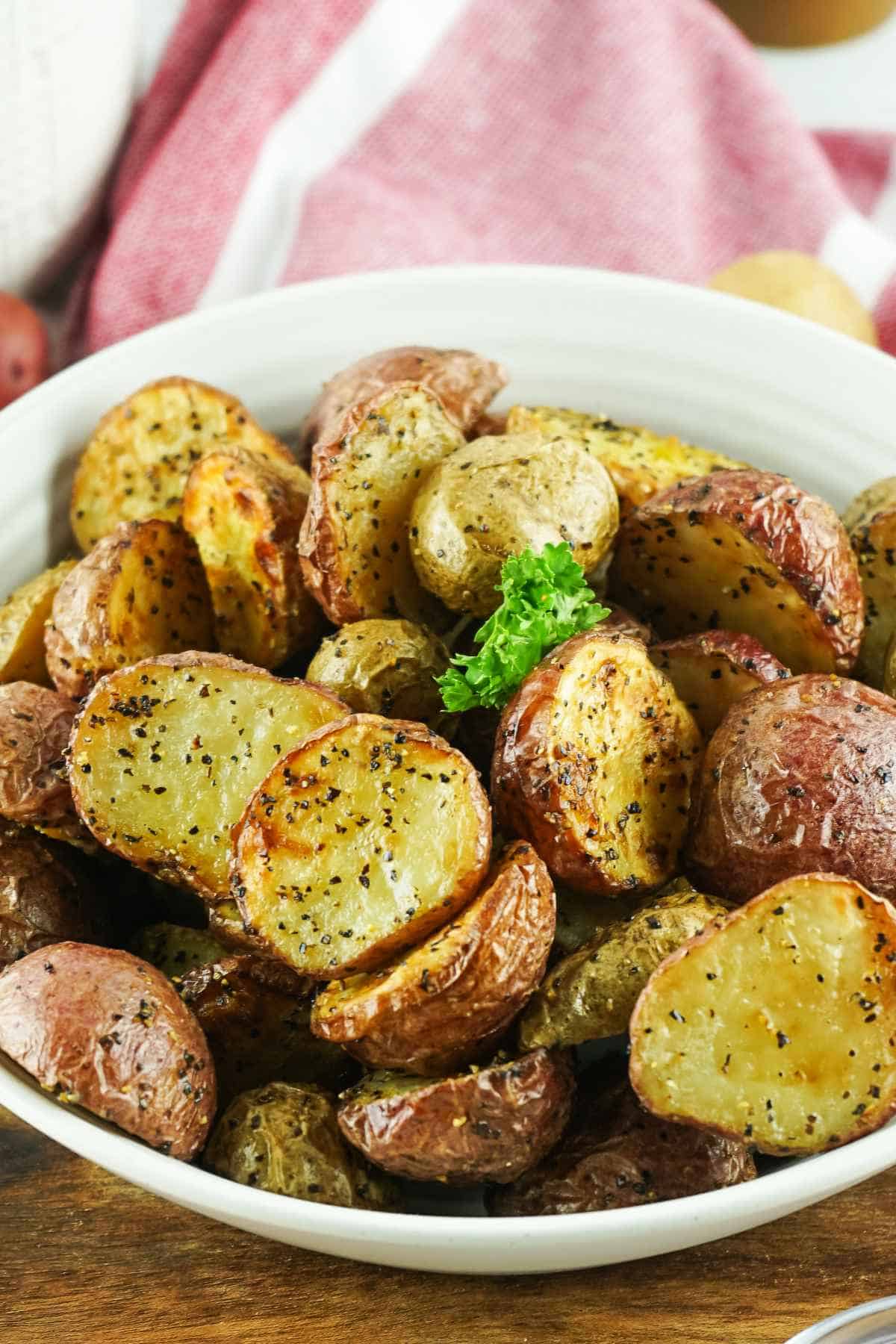 air fried red potatoes in a white bowl.
