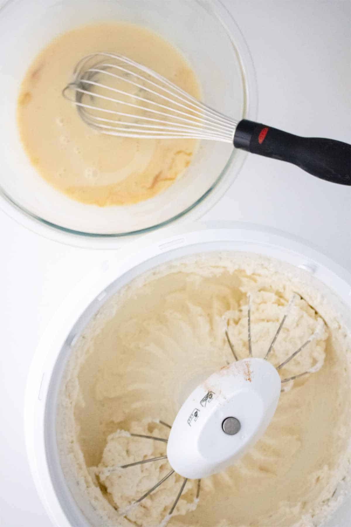 bowl of condensed milk and vanilla extract and a bowl of whipping cream in a mixing bowl.