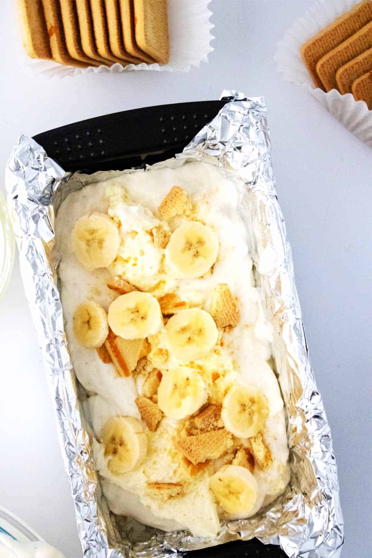 ice cream layers with sliced bananas and crushed sugar cookies.