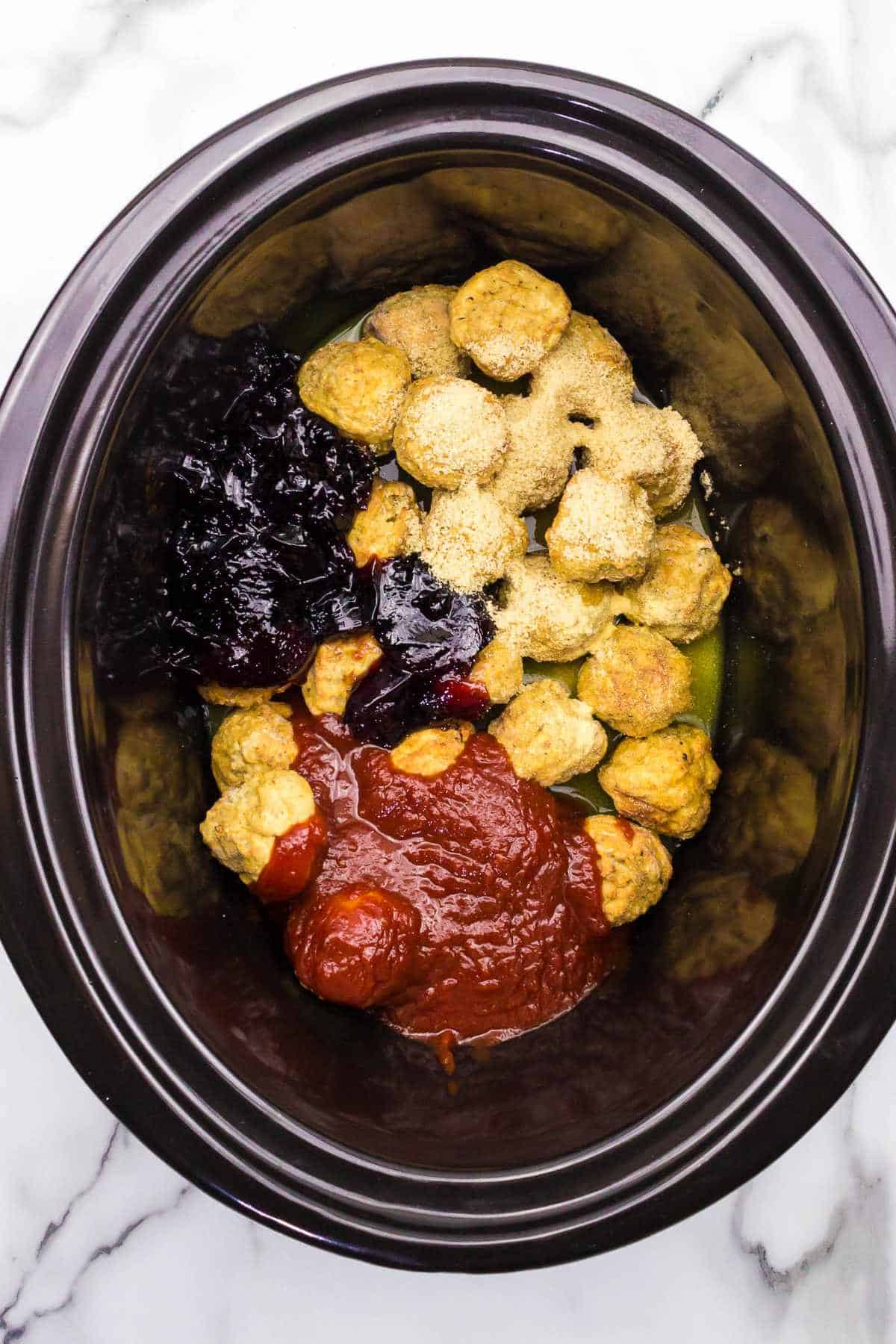 seasonings and grape jelly and chili sauce in a  slow cooker.