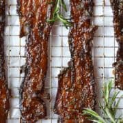 candied bacon cooling on a rack.