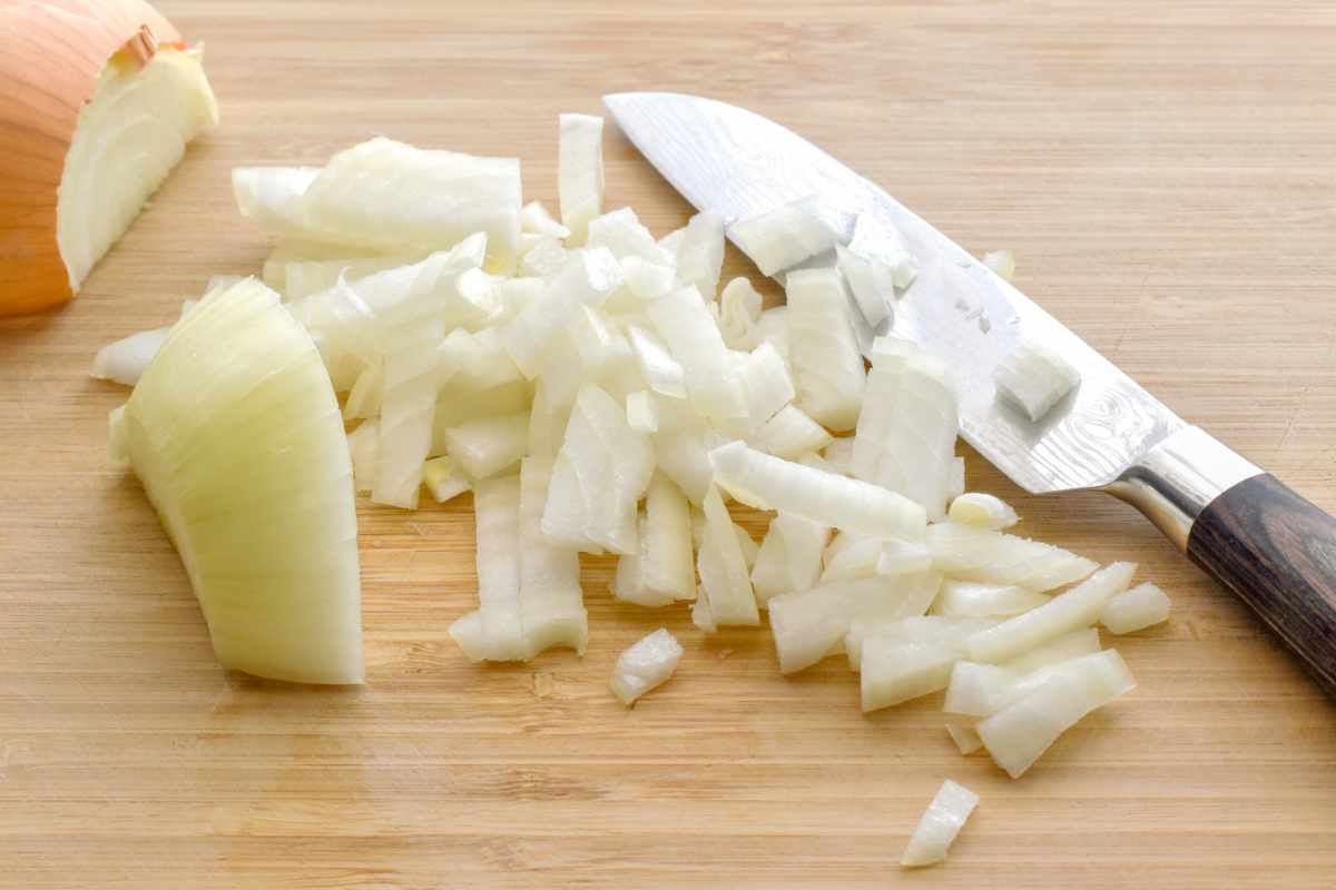 Sliced onion on a chopping board.