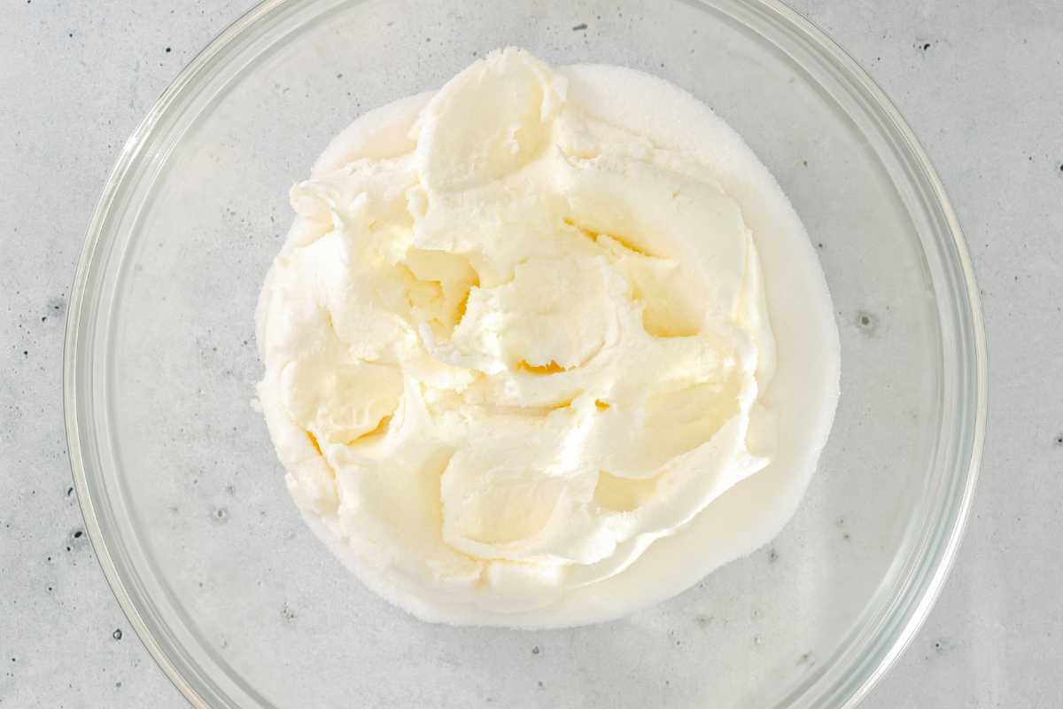 Cream cheese and sour cream in a bowl.