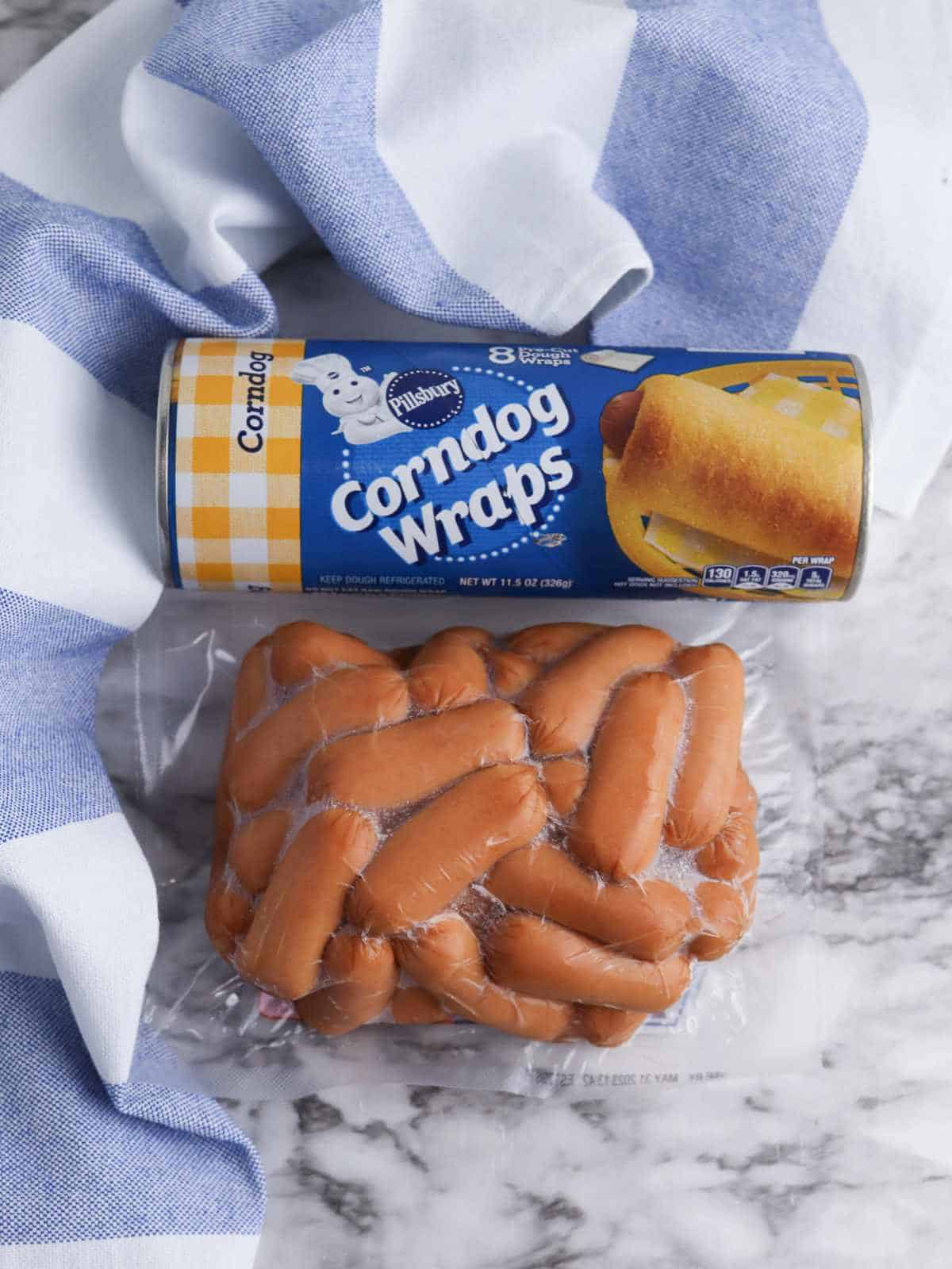 Roll of Pillsbury corndog wraps and mini smoked sausages.