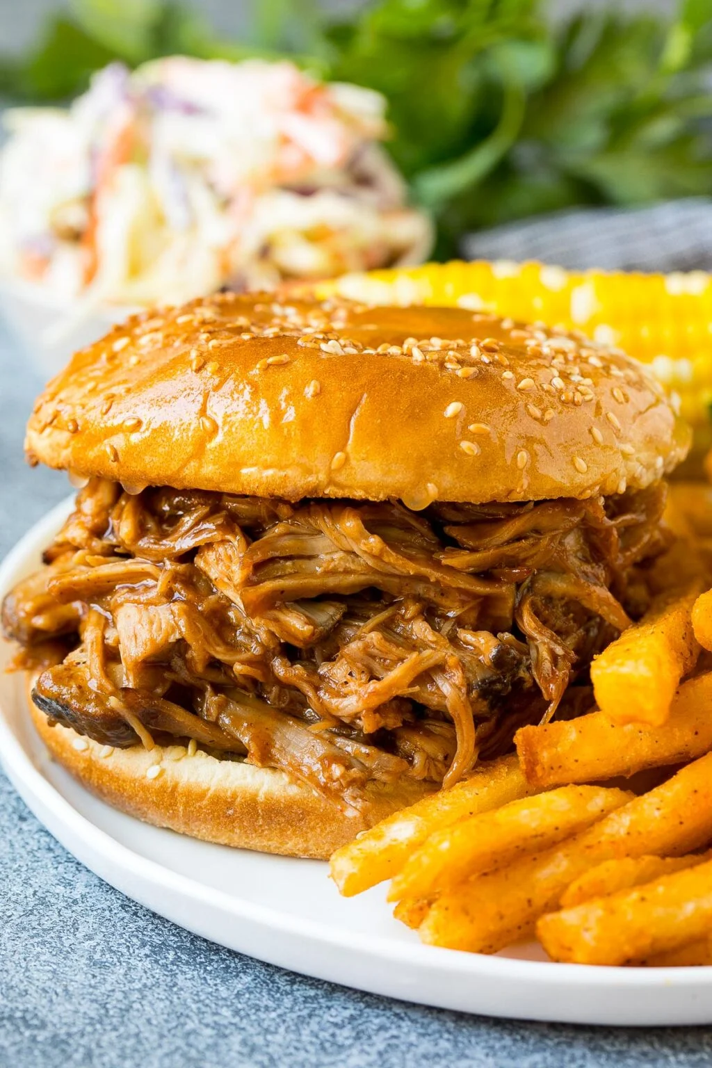 Pulled pork on a bun with fries is something your father would love on father's day.