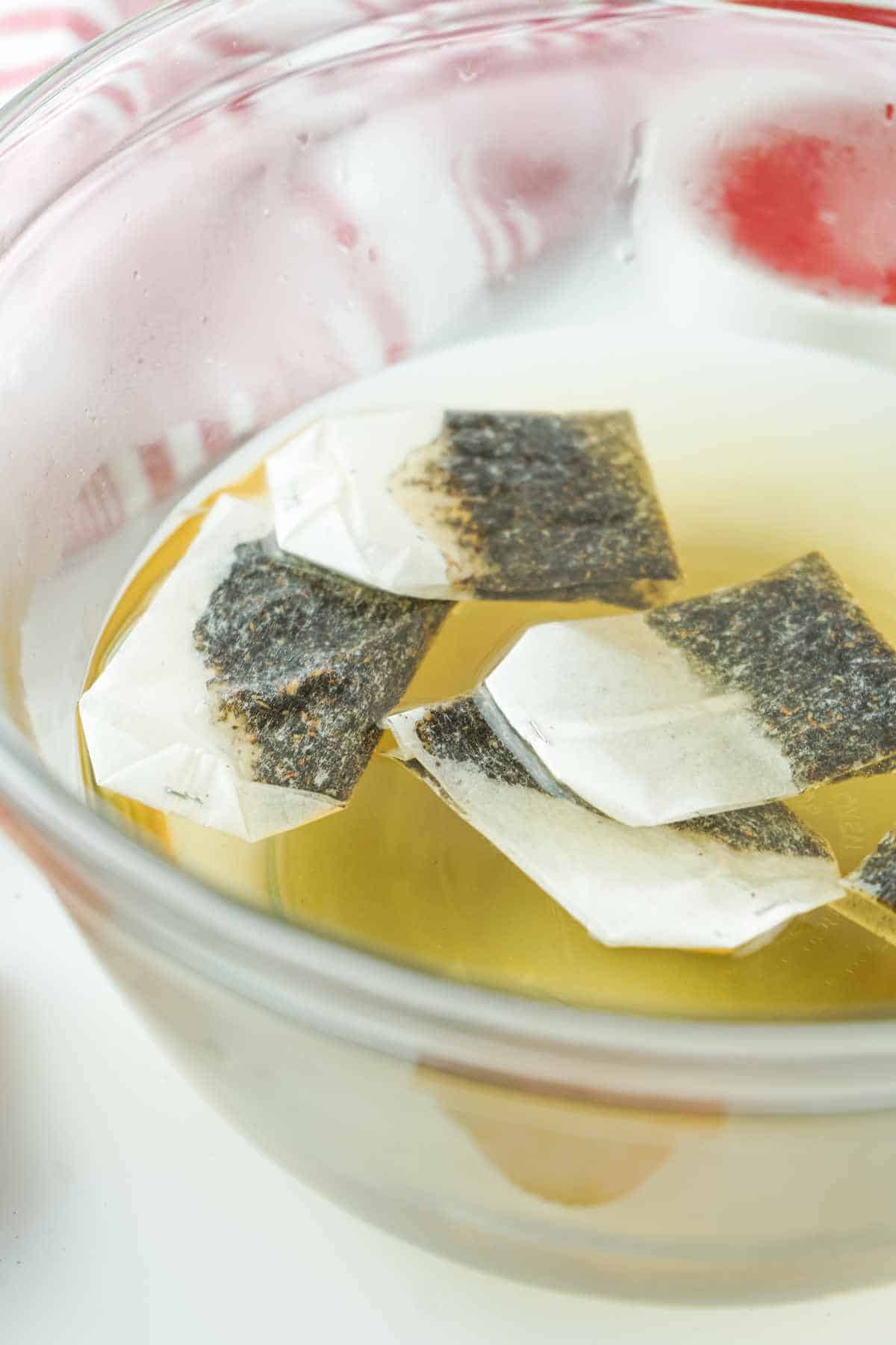 tea bags added to hot water and dissolved sugar.