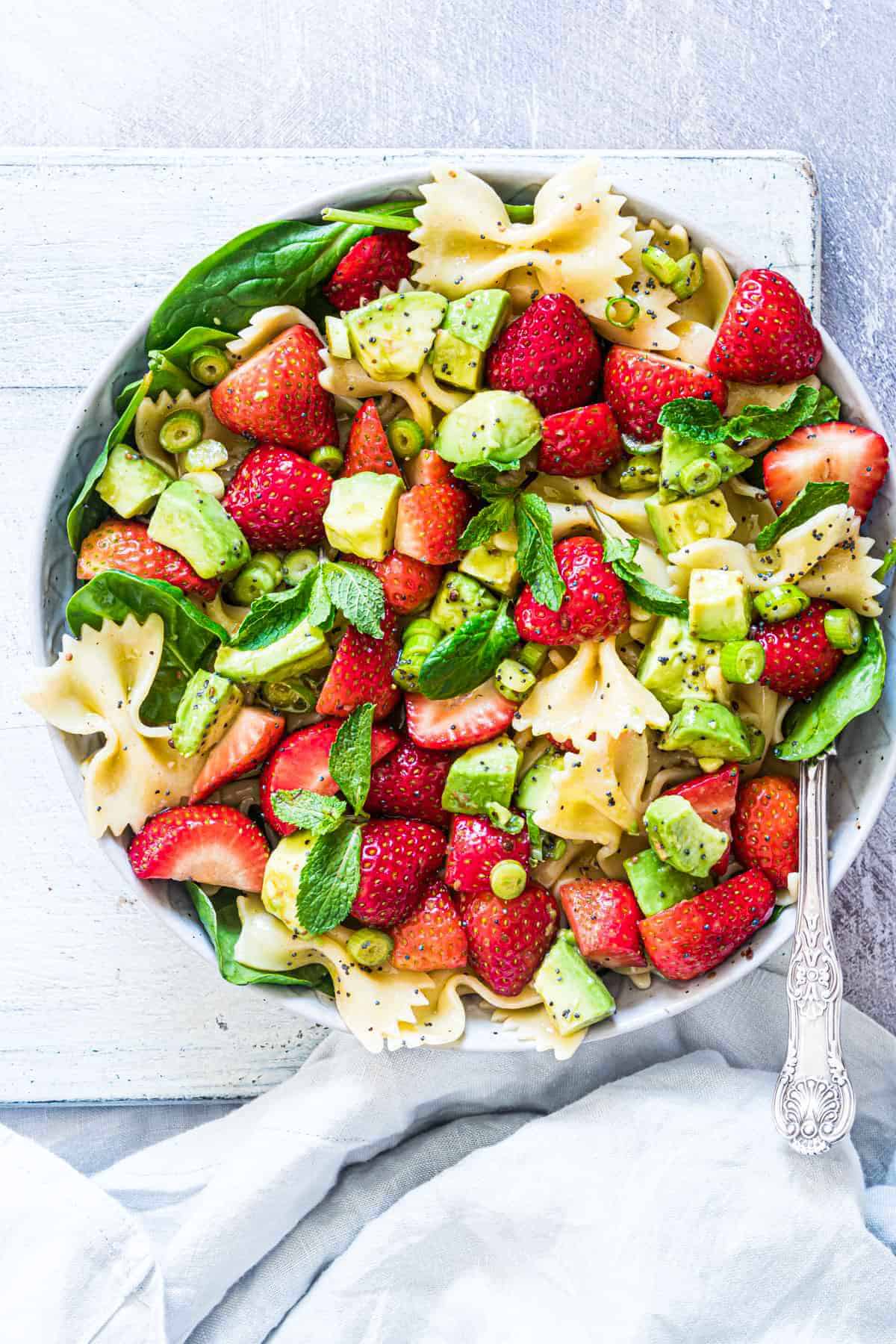 pasta salad with avocado and strawberries.