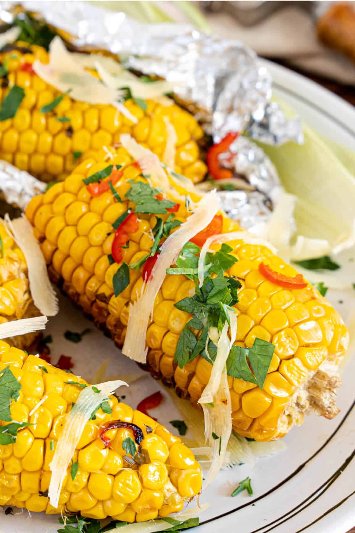 garnished smoked corn with parmesan and parsley.