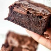 large brownie held up.