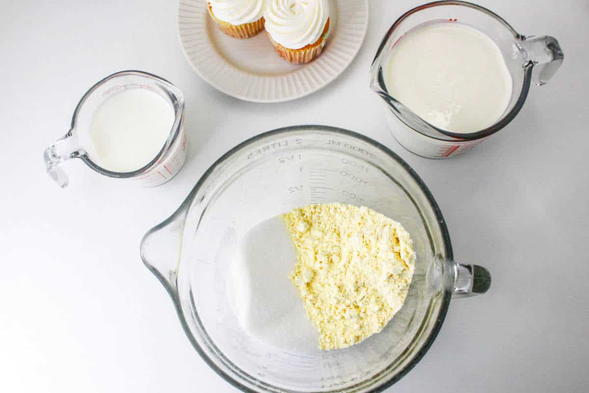 yellow cake mix, cream, milk, and cupcakes for making birthday cake ice cream.