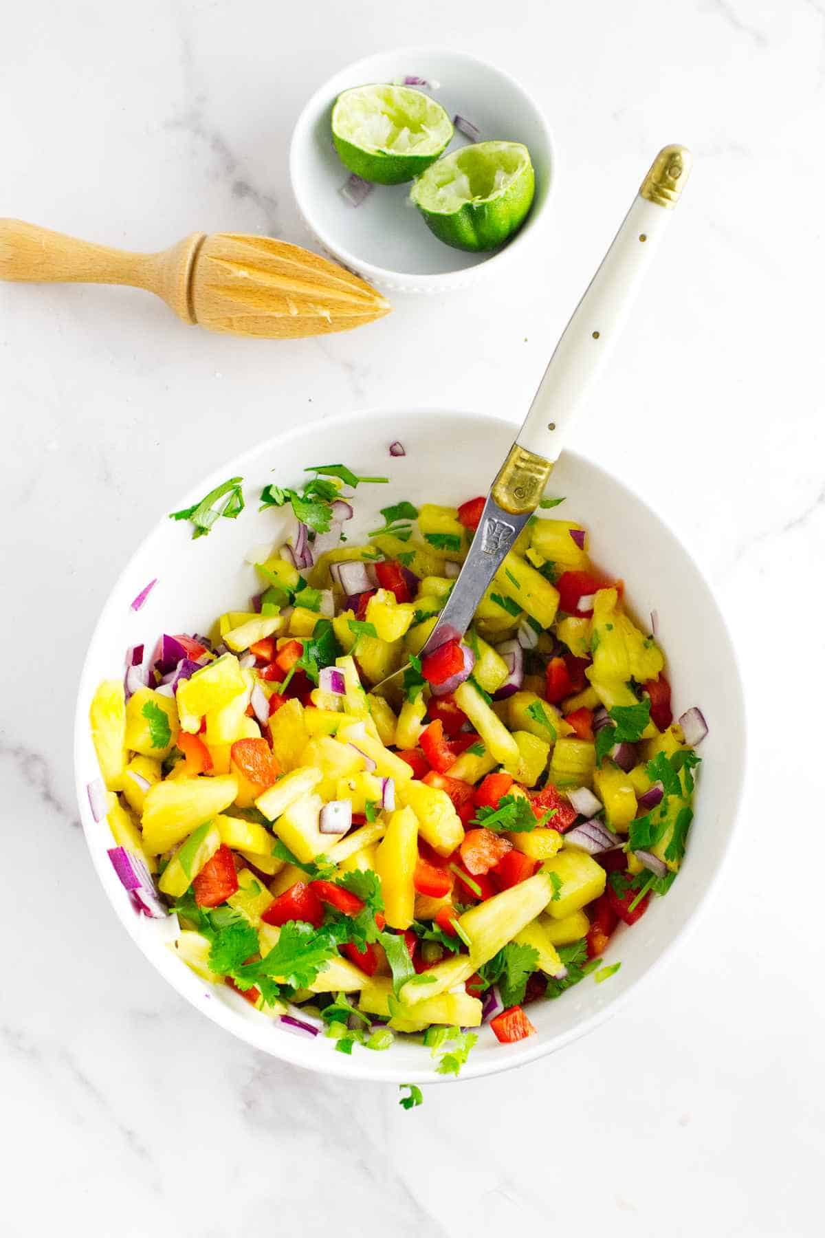 tossed pineapple and vegetables with lime juice.
