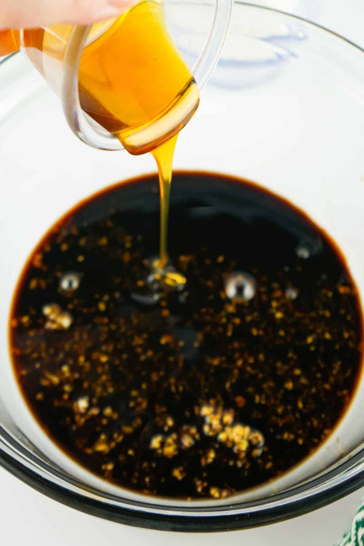 honey added to bowl of soy.