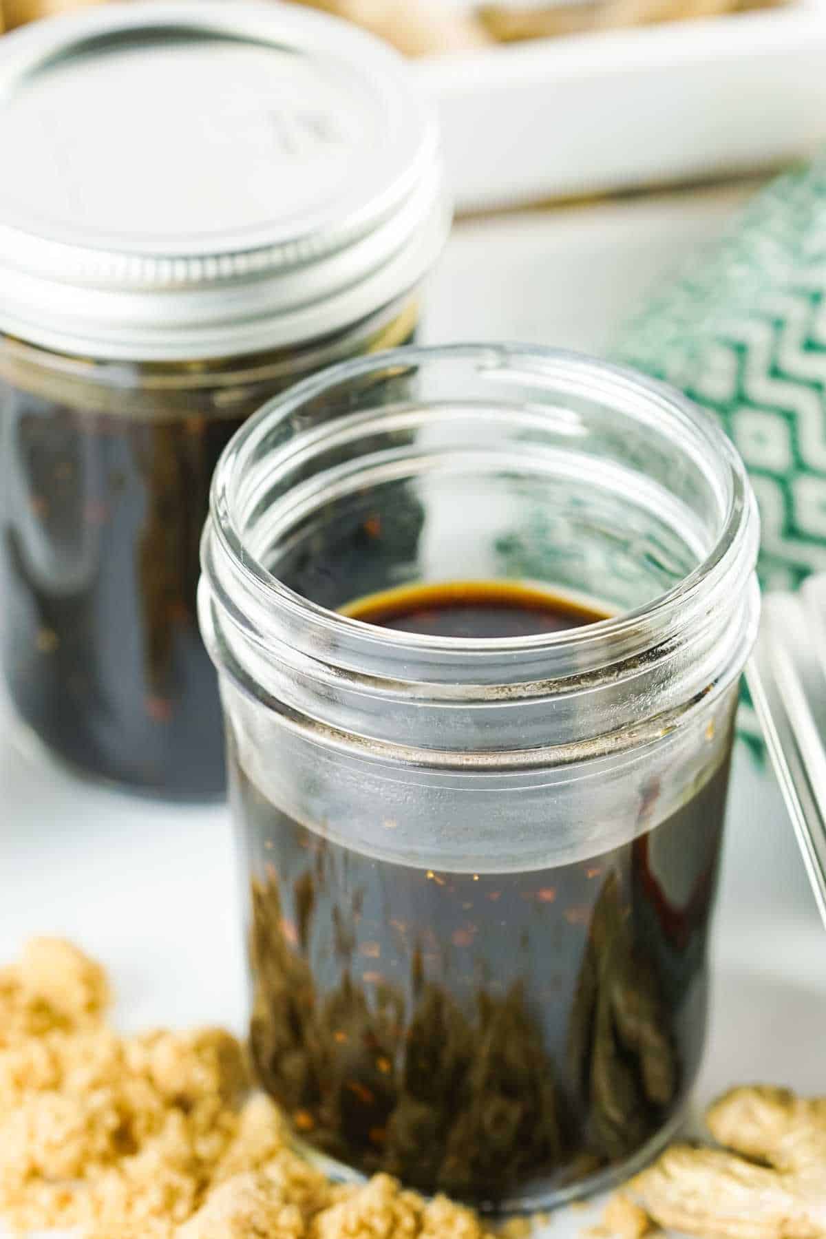 mason jar with dark liquid soy based seasoning.