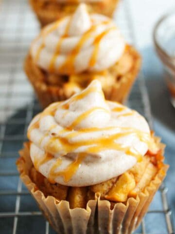 cinnamon buttercream frosted apple cider cupcakes.