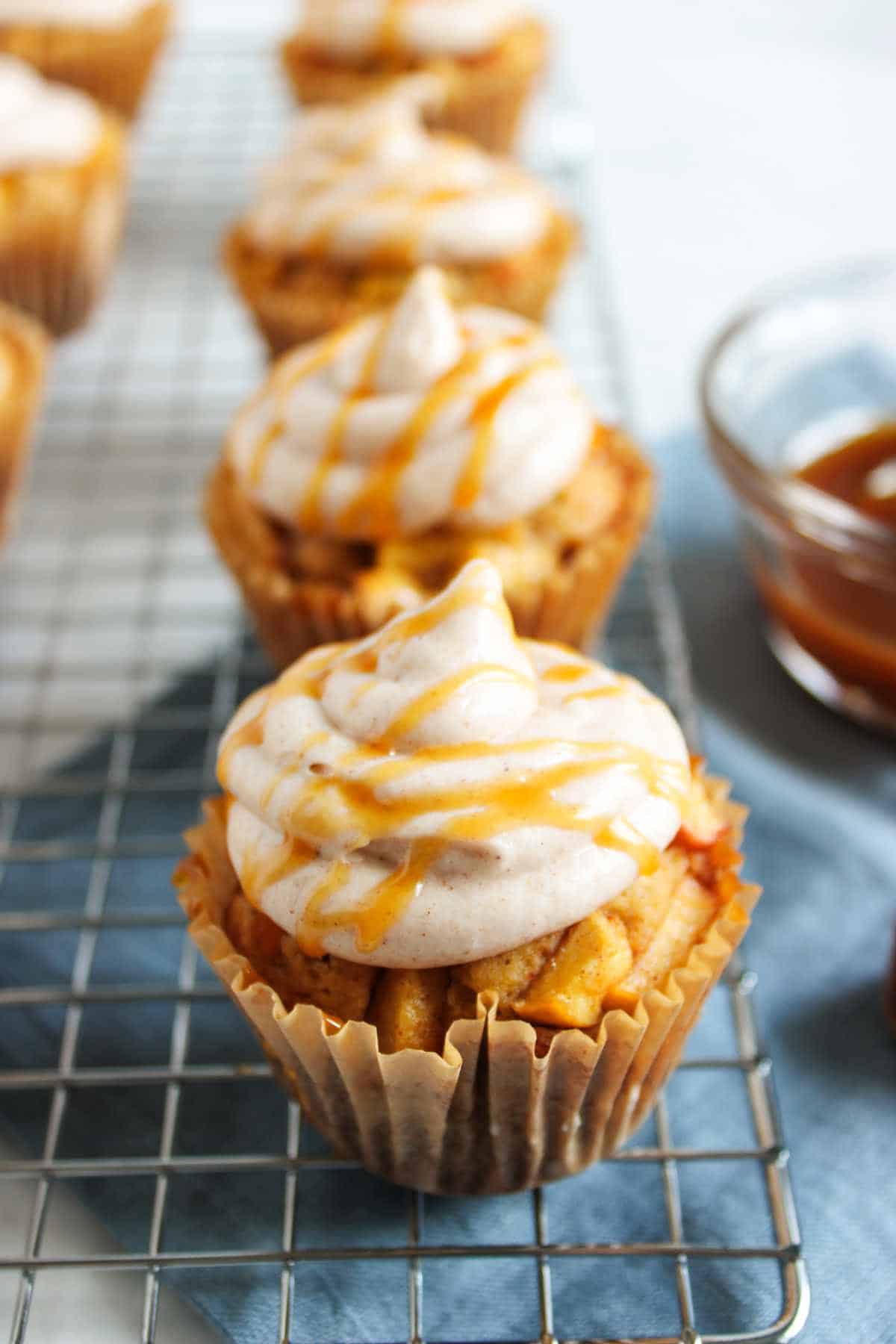 caramel drizzled cinnamon buttercream frosted spice cupcakes.