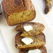sliced bread machine banana bread on a cutting board.