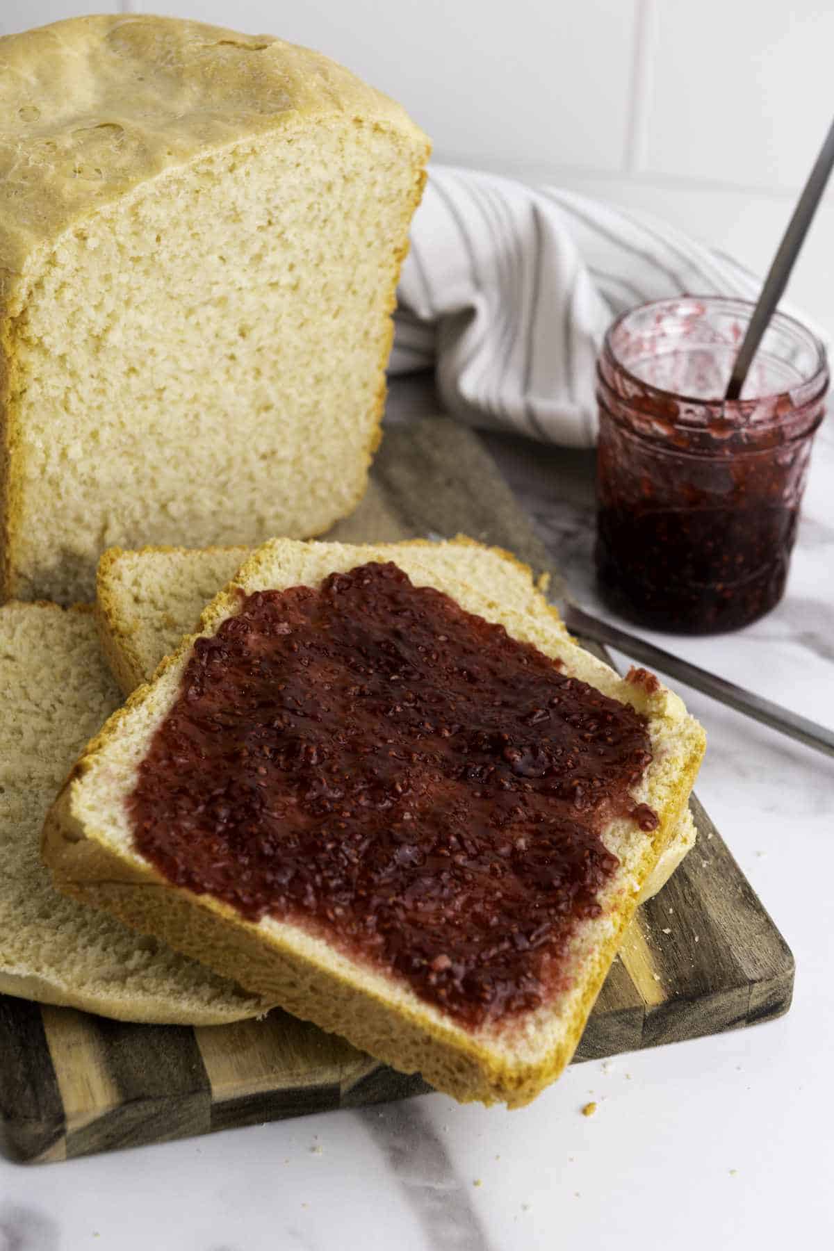 honey wheat bread machine recipe with jam on it.