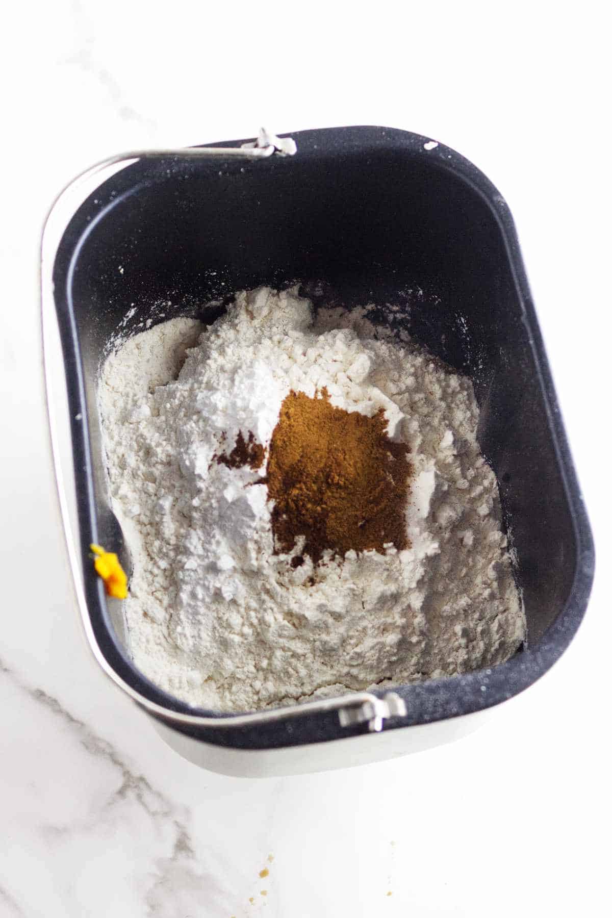 flour and spices added to breadmaker pan.