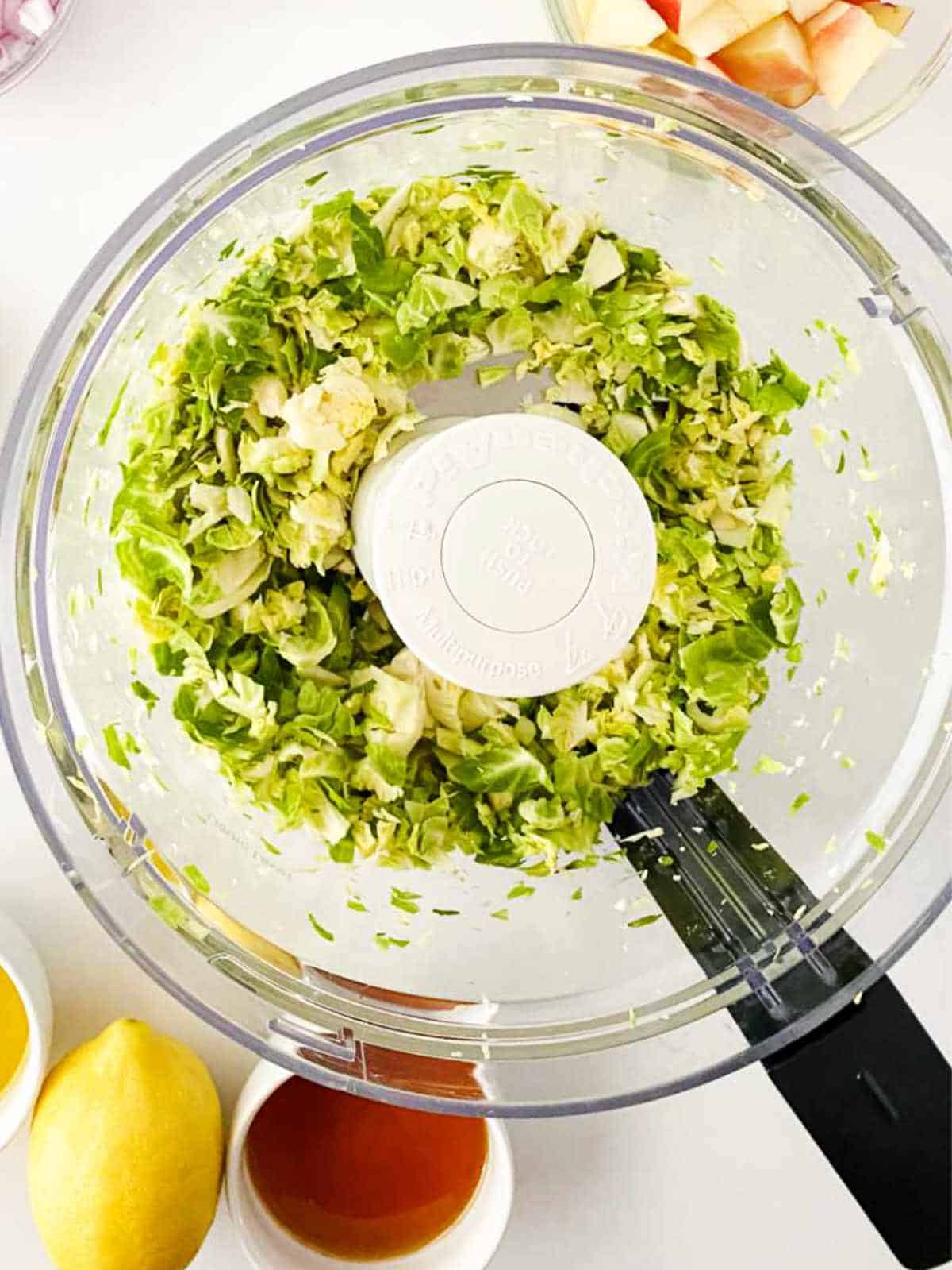 shredded brussels sprouts in a food processor.
