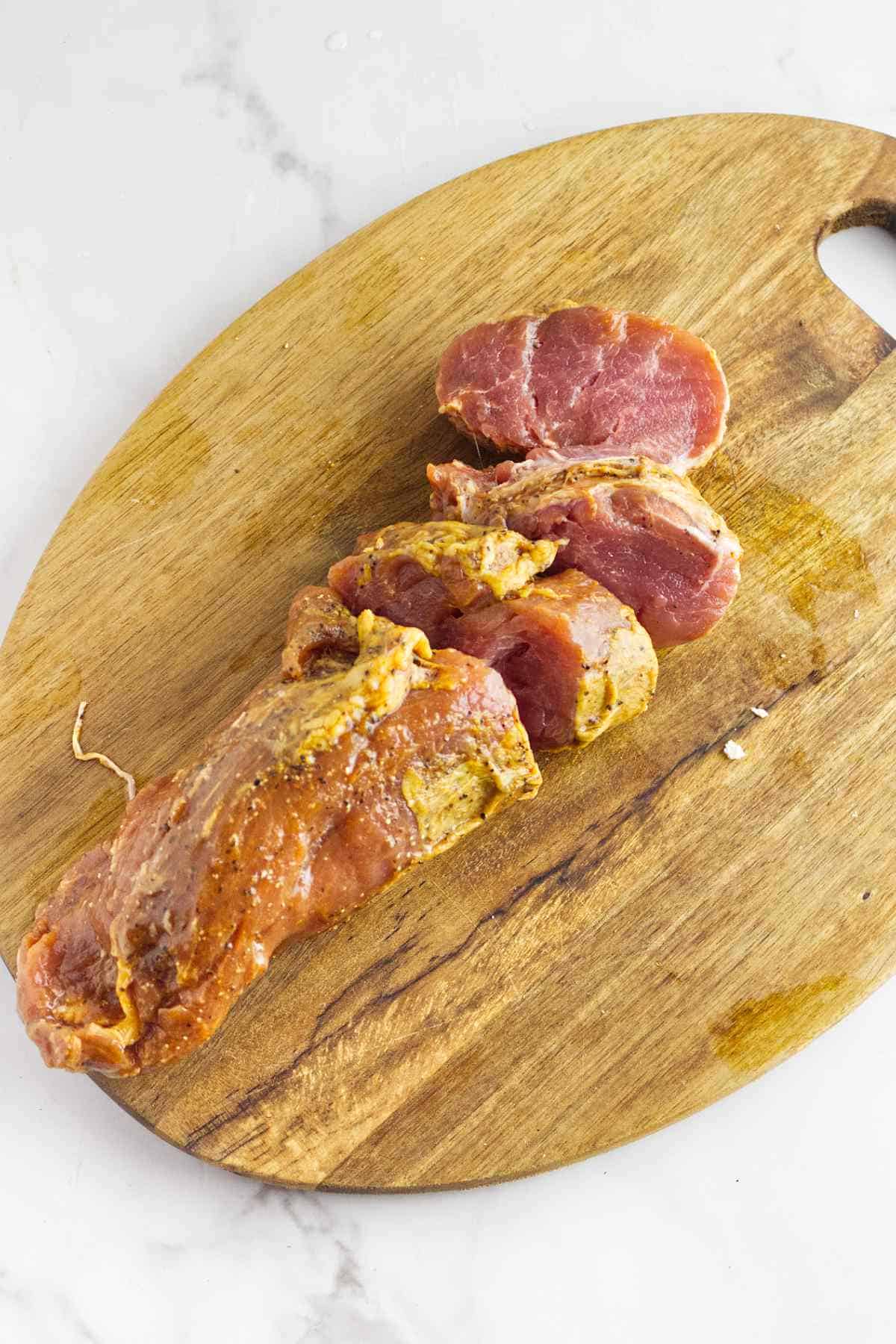 slicing meat into medallions.