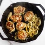 cast iron seared pork tenderloin medallions with onions.
