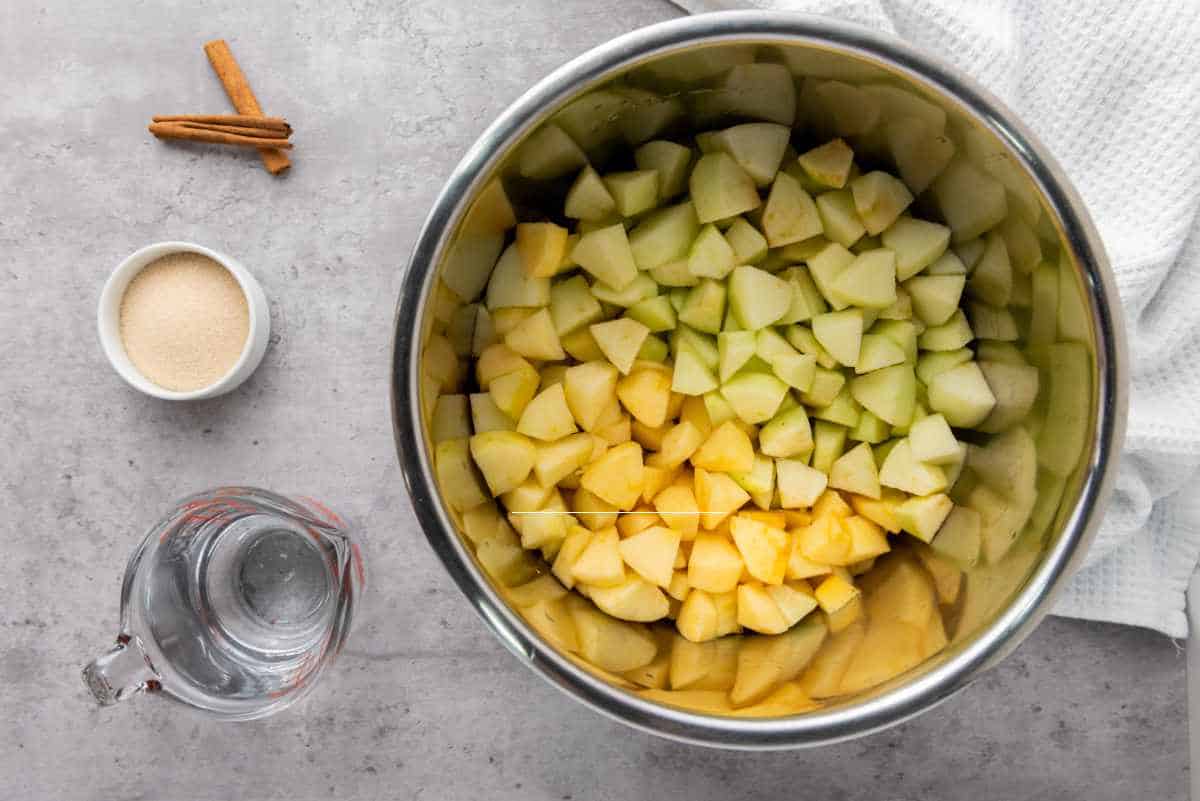 chopped peeled apples in an Instant Pot insert.