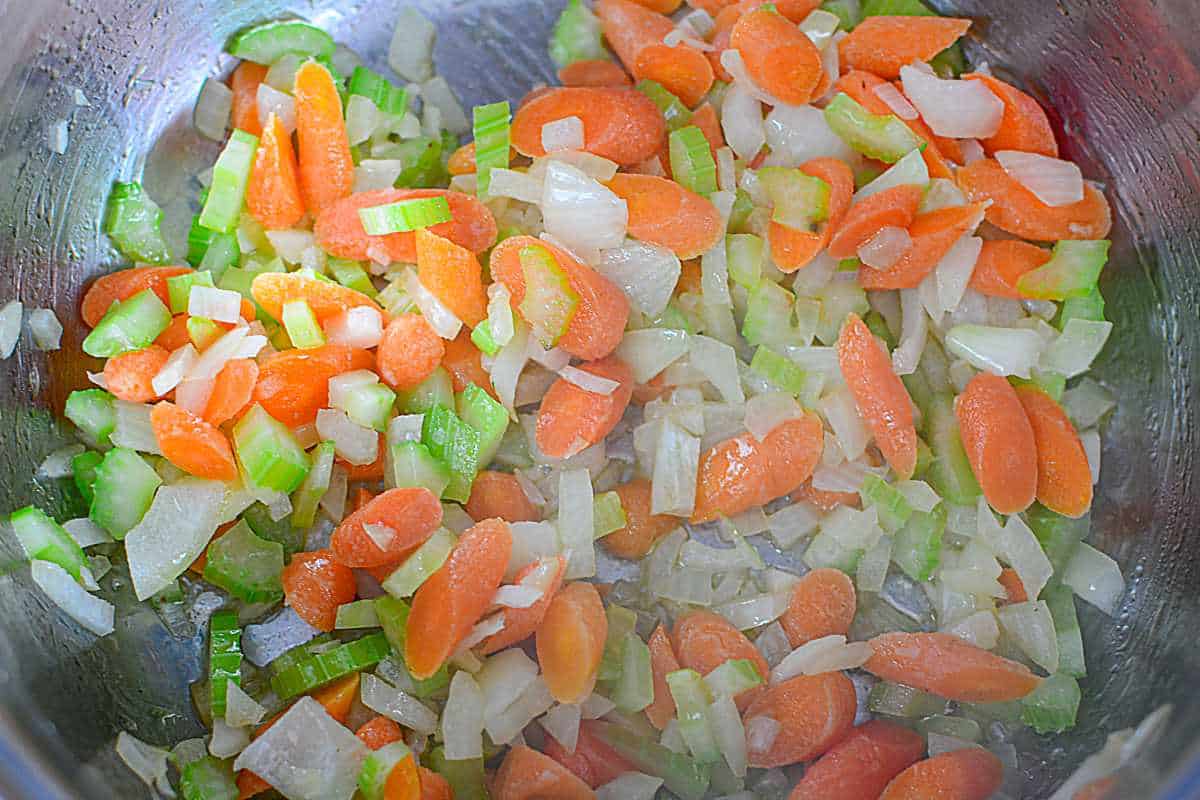 mirepoix sauteed in a large soup pot.