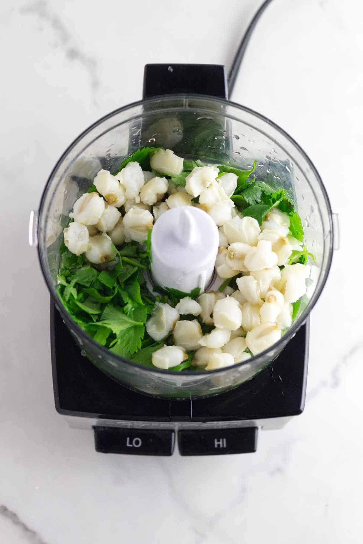 hominy and cilantro in a mini food processor.