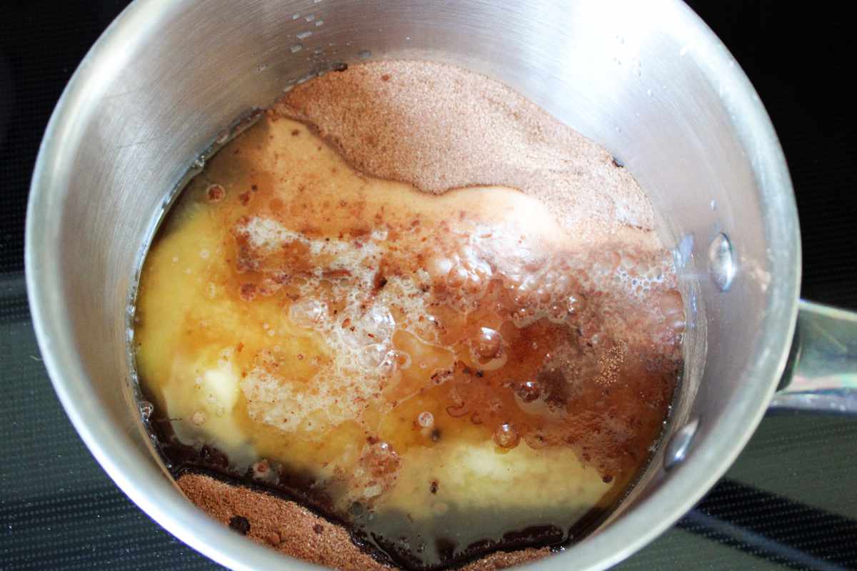 melted butter with sugar and cocoa powder in a sauce pan.