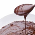a spoon scoop in melted chocolate.