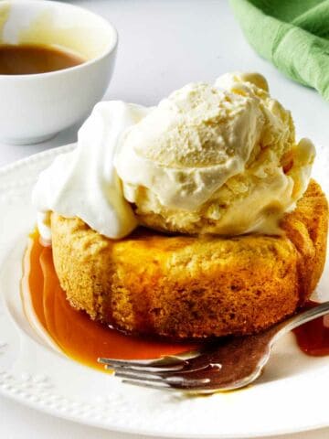 del frisco's butter cake with ice cream, caramel sauce, and whip cream.