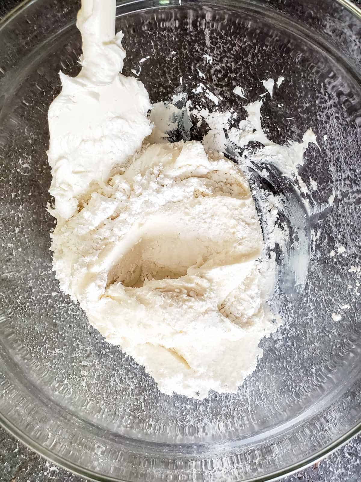 powdered sugar blended into bowl of store bought frosting.