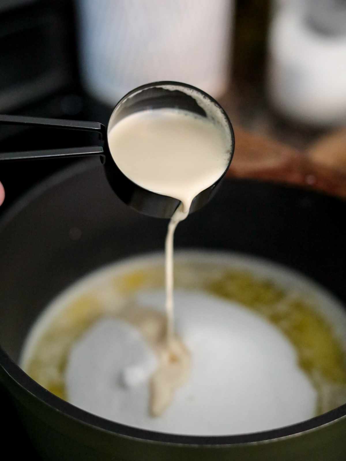 milk added to pot of sugar and butter.