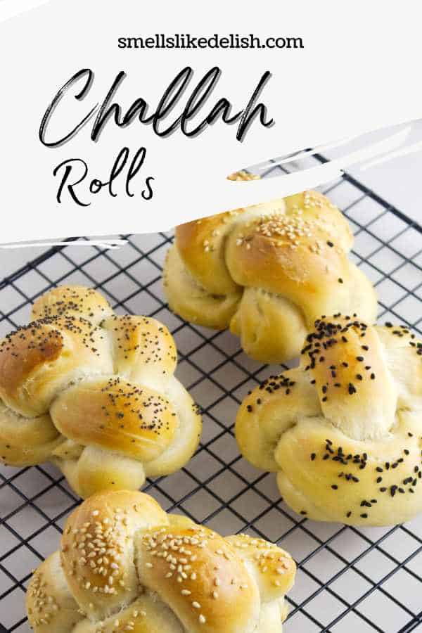 cooking rack with four challah rolls.