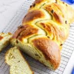 baked challah with raisins on a cooling rack.