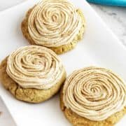 swirl frosted cinnamon cookies on a serving platter.