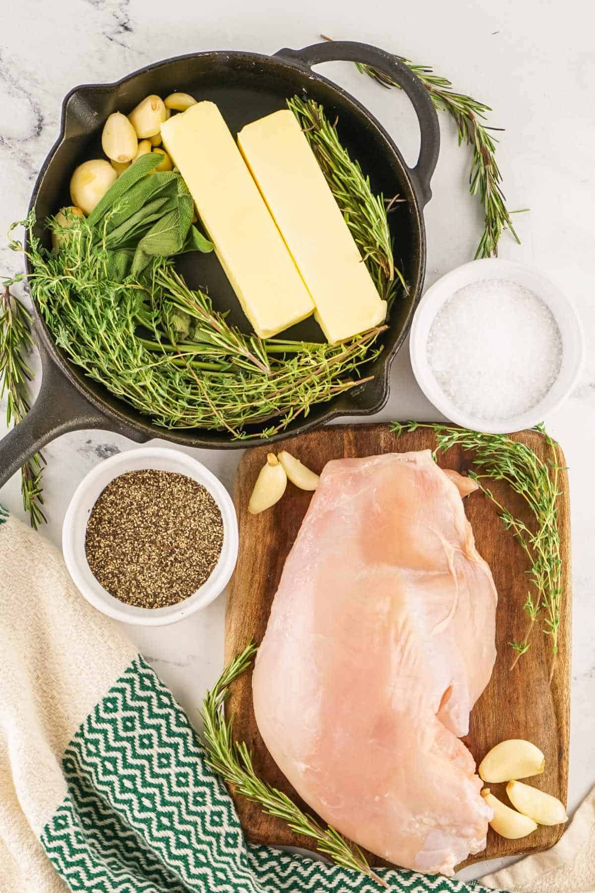 butter, garlic, herbs, and raw boneless turkey breast.