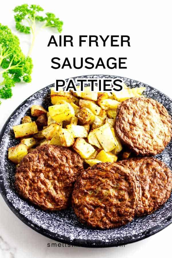 air fryer sausage patties on a plate with air fried diced potatoes.