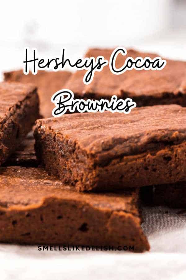 pile of Hershey cocoa brownies on a plate.