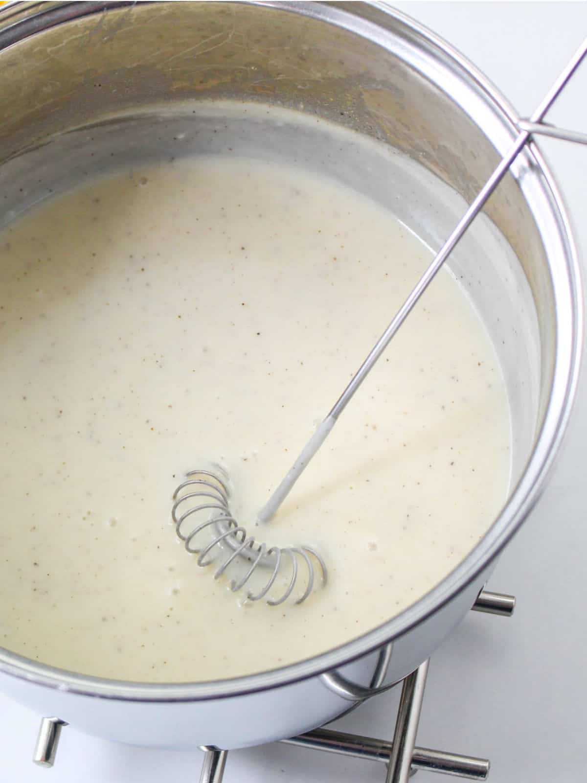 thickened roux whisked with milk into a smooth sauce.
