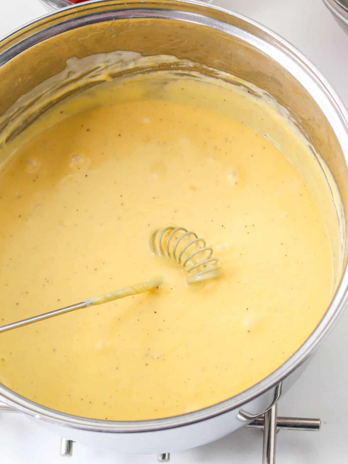 cheese melted into roux to form a thick cheese sauce.