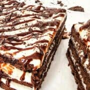 Chocolate ganache drizzled on brownie lasagna.