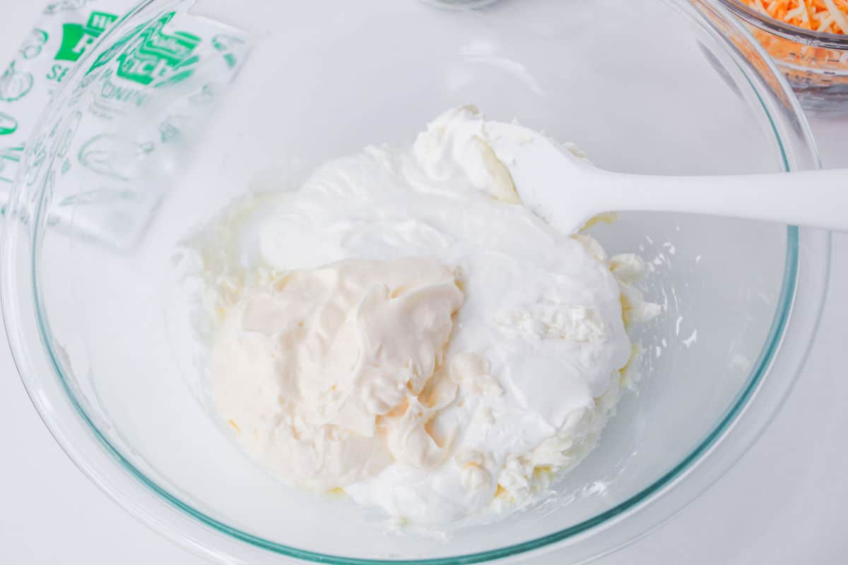cream cheese and sour cream in a bowl.