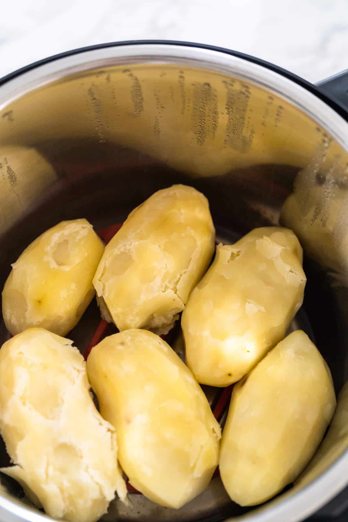 Letting cooked potatoes sit in pot to dry out.