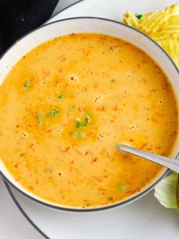 bowl of red pepper and gouda soup.