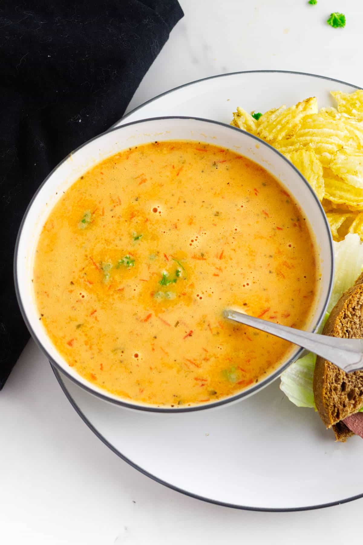 Bowl of red pepper and gouda soup.