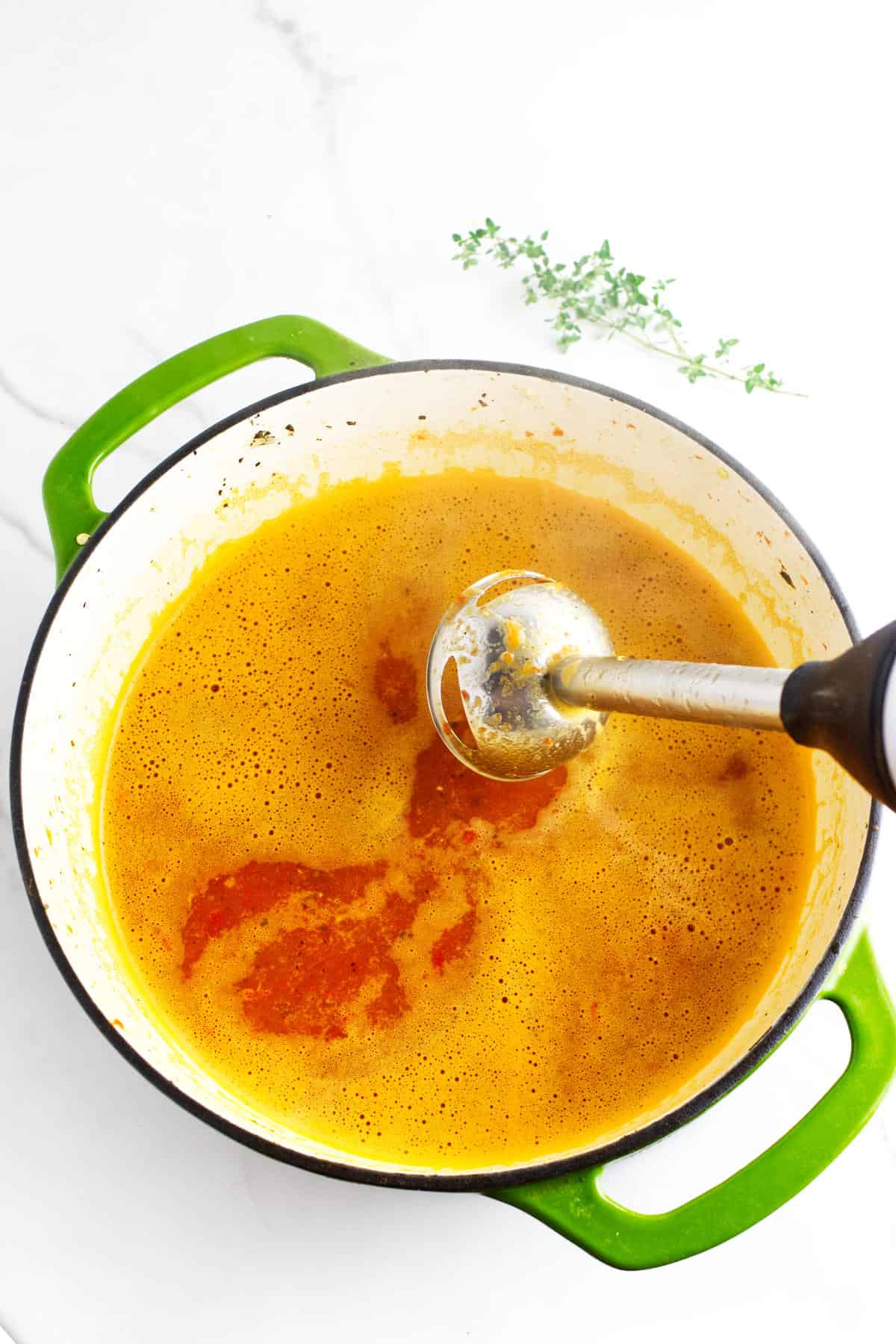Immersion blender to puree the red pepper soup.
