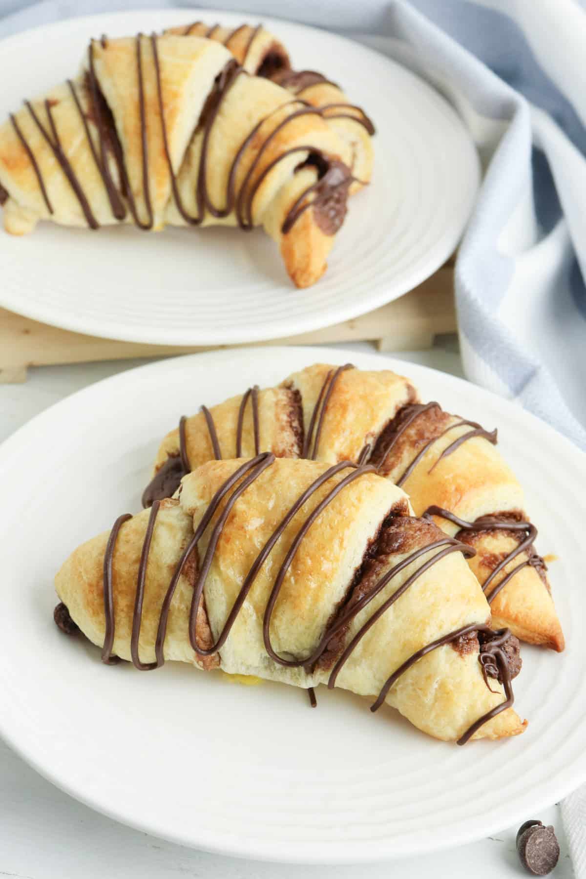 dessert plate with two crescent rolls.