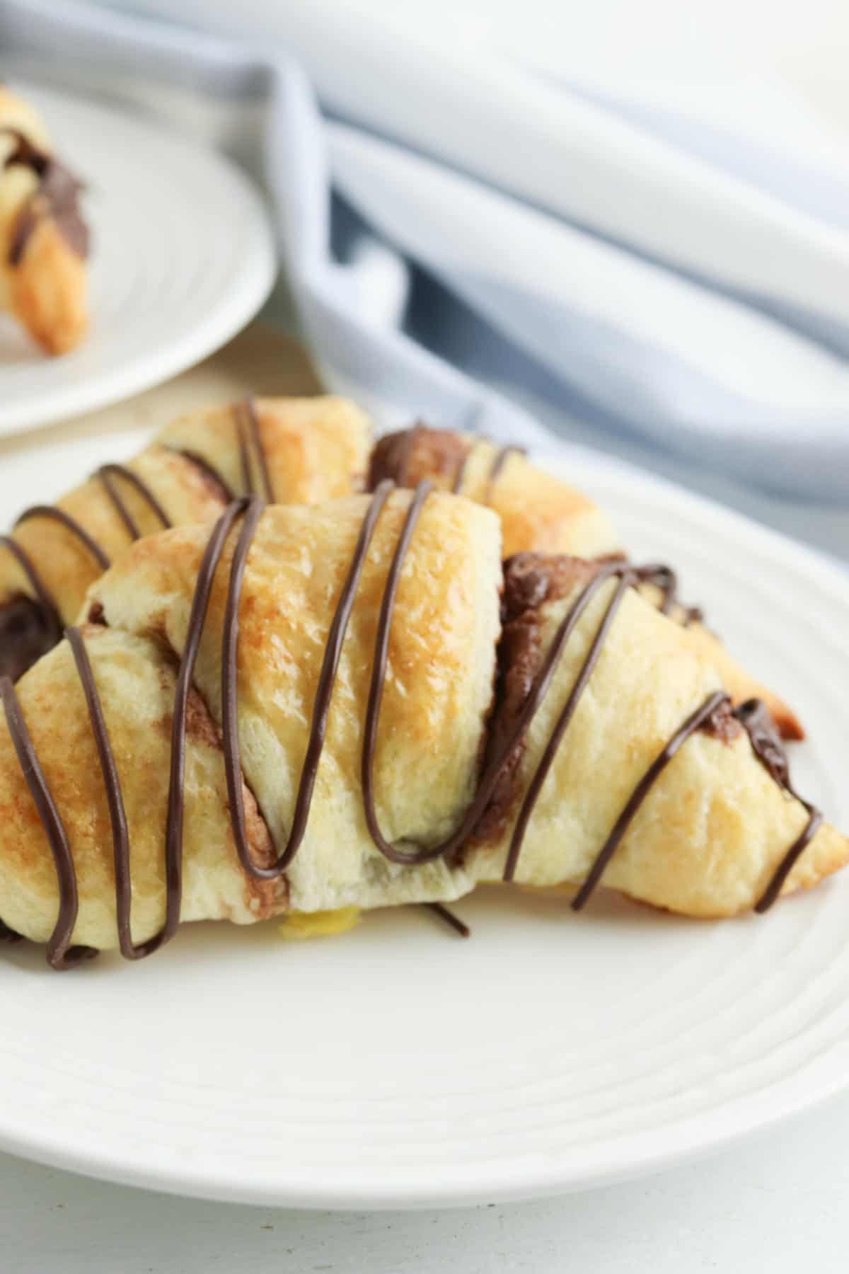 dessert plate with two crescent rolls.