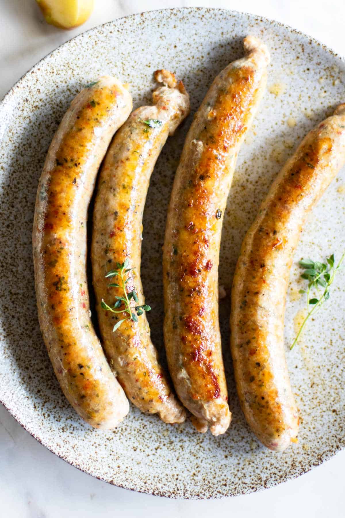 fried sausages on a plate.